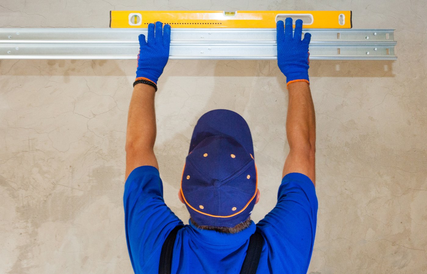A2Z Garage Doors technician fitting a garage door rail